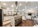 Open-concept kitchen features a large island, stainless steel appliances, and seamless flow to the bright living room at 2508 Brookwood Ne Dr, Atlanta, GA 30305