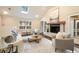 Bright living room boasts a vaulted ceiling, skylight, fireplace, and access to the outdoor spaces at 2508 Brookwood Ne Dr, Atlanta, GA 30305