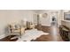 Cozy living room area featuring hardwood floors, comfortable seating, and easy access to the kitchen at 2508 Brookwood Ne Dr, Atlanta, GA 30305