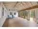 Charming screened porch is equipped with a ceiling fan and views of the surrounding landscape at 2508 Brookwood Ne Dr, Atlanta, GA 30305