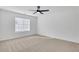 Bedroom featuring a ceiling fan, natural light, and plush carpeting at 2964 Hollow Ln, Powder Springs, GA 30127