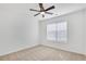 Bedroom with ceiling fan, neutral carpet, and a window for natural light at 2964 Hollow Ln, Powder Springs, GA 30127