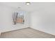 Bedroom featuring a window with backyard views and neutral carpet at 2964 Hollow Ln, Powder Springs, GA 30127