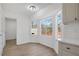 Bright breakfast nook features bay windows, hardwood floors, and natural light at 2964 Hollow Ln, Powder Springs, GA 30127