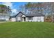 Charming home with lush green lawn, manicured landscaping, and welcoming curb appeal at 2964 Hollow Ln, Powder Springs, GA 30127