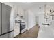 Modern kitchen with stainless steel appliances, white cabinets, subway tile backsplash, and quartz countertops at 2964 Hollow Ln, Powder Springs, GA 30127