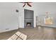 Charming living room showcasing a stone fireplace, vaulted ceiling, and hardwood floors at 2964 Hollow Ln, Powder Springs, GA 30127