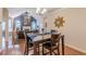 Open-concept dining area with hardwood floors and modern decor at 4479 Caleb Xing, Powder Springs, GA 30127