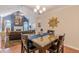 Elegant dining area with hardwood floors, view of the living room, and modern decor at 4479 Caleb Xing, Powder Springs, GA 30127