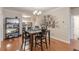 Dining area with hardwood floors, modern lighting, and a view into the kitchen at 4479 Caleb Xing, Powder Springs, GA 30127