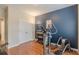 Exercise room features a treadmill, adjacent to a double door closet and a dark accent wall at 4479 Caleb Xing, Powder Springs, GA 30127