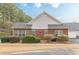 Charming single-story home with manicured landscaping, brick accents, and white siding at 4479 Caleb Xing, Powder Springs, GA 30127