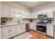 Bright kitchen with stainless steel appliances, gas range, and ample counter space for meal prep at 4479 Caleb Xing, Powder Springs, GA 30127