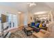 Spacious living room with hardwood floors, a fireplace, and comfortable seating at 4479 Caleb Xing, Powder Springs, GA 30127