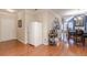 Open-concept living room with hardwood floors flows into the dining area, perfect for entertaining at 4479 Caleb Xing, Powder Springs, GA 30127