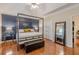 Main bedroom boasts a striking canopy bed and hardwood floors at 4479 Caleb Xing, Powder Springs, GA 30127