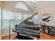 Beautiful piano room featuring a grand piano and multiple windows at 4479 Caleb Xing, Powder Springs, GA 30127