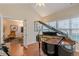Spacious room featuring a grand piano with hardwood flooring at 4479 Caleb Xing, Powder Springs, GA 30127