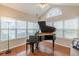 Bright piano room with ample natural light and hardwood flooring at 4479 Caleb Xing, Powder Springs, GA 30127