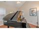 Well-lit piano room featuring a grand piano and elegant decor at 4479 Caleb Xing, Powder Springs, GA 30127