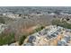 Aerial view of houses backing up to wooded area, highlighting the desirable community setting at 3650 Bentbill Xing, Cumming, GA 30041