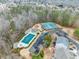 Aerial view of community pool and tennis courts, providing recreational amenities for residents at 3650 Bentbill Xing, Cumming, GA 30041