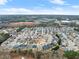 A high-angle aerial shot reveals a sprawling suburban neighborhood on a clear day at 3650 Bentbill Xing, Cumming, GA 30041