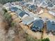 Overhead view showcases the home's backyard, patio area, and the surrounding neighborhood landscape at 3650 Bentbill Xing, Cumming, GA 30041