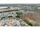 Aerial view showing homes adjacent to a wooded area, emphasizing community's setting at 3650 Bentbill Xing, Cumming, GA 30041