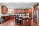 Spacious kitchen featuring a large island, stainless steel appliances, and hardwood floors at 3650 Bentbill Xing, Cumming, GA 30041