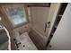 Bathroom featuring a white bathtub and shower, a sink with a marbled countertop and a storage closet at 4973 Horton Pl, Douglasville, GA 30135