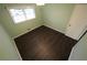 Bedroom with wood floors, a window, and light green walls at 4973 Horton Pl, Douglasville, GA 30135