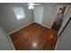 Bedroom featuring wood floors, a window, and a double closet at 4973 Horton Pl, Douglasville, GA 30135