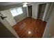 Bedroom featuring wood floors, a ceiling fan, a window and a double closet at 4973 Horton Pl, Douglasville, GA 30135