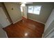 Bedroom featuring wood floors, a ceiling fan, a window and a closet at 4973 Horton Pl, Douglasville, GA 30135