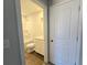 Clean bathroom featuring a tub/shower combo, single sink, and wood-look flooring at 2359 Brown Dove Way (Lot 2), Grayson, GA 30017