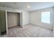 Bright bedroom featuring neutral carpet, a closet, and a window offering natural light at 2359 Brown Dove Way (Lot 2), Grayson, GA 30017