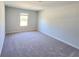 Carpeted bedroom with window for natural light at 2359 Brown Dove Way (Lot 2), Grayson, GA 30017