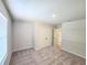 Spacious carpeted bedroom with a double door closet and natural lighting at 2359 Brown Dove Way (Lot 2), Grayson, GA 30017