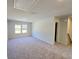 Spacious bedroom with plush carpeting and ample natural light from the window at 2359 Brown Dove Way (Lot 2), Grayson, GA 30017