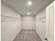 Walk-in closet featuring built-in shelving at 2359 Brown Dove Way (Lot 2), Grayson, GA 30017