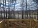 Elevated lake view from a wooden deck through the trees at 2359 Brown Dove Way (Lot 2), Grayson, GA 30017