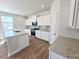 Modern kitchen featuring white cabinetry, granite countertops, and stainless steel appliances at 2359 Brown Dove Way (Lot 2), Grayson, GA 30017