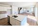 Open concept kitchen featuring granite counters and stainless steel appliances at 2359 Brown Dove Way (Lot 2), Grayson, GA 30017