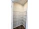 Walk-in pantry with wire shelving providing ample storage space, complemented by wood-look flooring at 2359 Brown Dove Way (Lot 2), Grayson, GA 30017