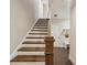 Staircase featuring wood steps, white risers, and hardwood flooring at 639 Brennan Dr, Decatur, GA 30033