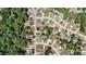 Overhead shot capturing a suburban neighborhood bordered by a dense, mature green forest at 3113 Brians Creek Se Dr, Conyers, GA 30013