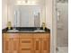 Bathroom featuring double sink vanity with granite countertops and a glass shower at 3113 Brians Creek Se Dr, Conyers, GA 30013