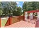 Outdoor deck area with pergola offers ample space for relaxing and outdoor dining at 3113 Brians Creek Se Dr, Conyers, GA 30013