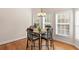 Cozy dining area with hardwood floors, chandelier, and lots of natural light at 3113 Brians Creek Se Dr, Conyers, GA 30013